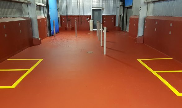 Red resinous flooring in food processing facility